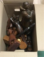 Box of wood carvings, tacking iron, hair clippers