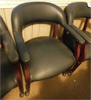 Vinyl upholstered office chair on casters