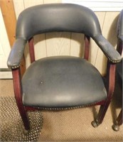 Vinyl upholstered office chair on casters