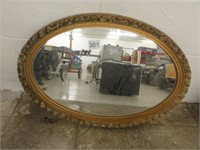 wall mirror with gold colored frame