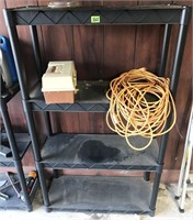 shelf and contents: tackle box, extension cord
