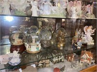 Misc shelf of globes/angels