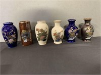 12 miniature oriental vases in plastic storage