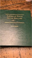 6 Silver American Eagle dollars w/ book