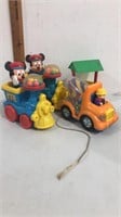 Pair of vintage Mickey Mouse pull trains, well