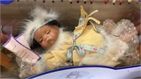Porcelain Indian doll on hammock in 22” long box