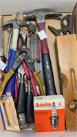 Assortment of tools such as hammers, saw, level,