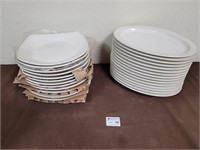 Used white glass serving platters and new plates