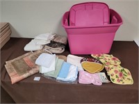 Pink bin, clothes, towels, etc
