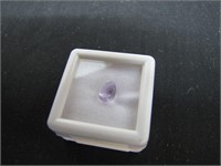 Pear Cut Faceted Amethyst in display case .90ct