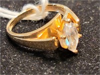 14k gold ring with clear stone.  Look at the