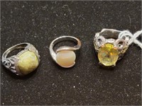 3 sterling rings with colored center stone