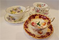 THREE PORCELAIN CUPS AND SAUCERS ONE PARAGON