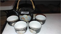 black Japanese teapot and 4 cups