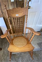 ornate cane bottom rocking chair
