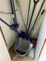 Assortment of brooms dustpans and snow shovel