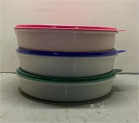 3 Tupperware bowls with colorful lids