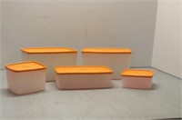 Tupperware storage containers with orange lids
