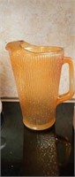 Orange Carnival glass pitcher about 9in tall