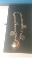 Have a gold tone necklace with large hearts
