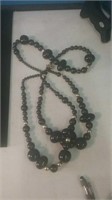 Long black bead double strand necklace