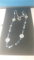 Dark blue and silver tone necklace