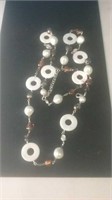 Silver tone necklace with amber beads and white