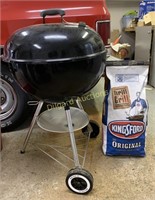 Weber grill and (2) bags of charcoal