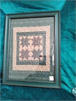 Framed quilt piece