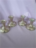 4 sterling candlestick holders