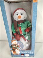 Snowflake spinning snowman plays Santa baby, in