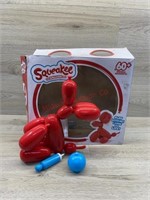 Squeakee the balloon dog toy has been opened
