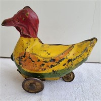 Antique rolling metal duck toy
