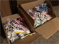 Two boxes of  hangers-kid size