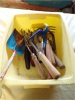 Plastic bin with 11 assorted gardening hand tools.