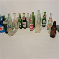 Various glass soda pop bottles