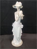Lladro figurine of a woman drinking tea