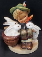 M. J. Hummel figurine of a boy with rabbits