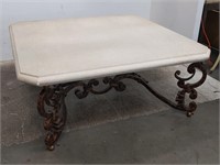 Marble-top coffee table on wrought iton base