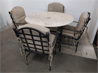 Marble top patio table with four chairs approx