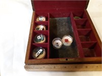 Wooden box with gemstones.