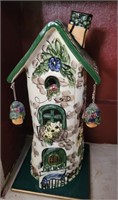 Ceramic birdhouse.