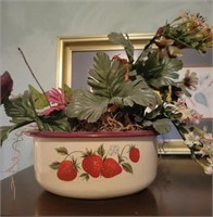 Heavy bowl with fake flowers.