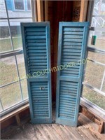 Old wooden two toned shutters