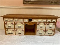 Wooden spice cabinet with porcelain drawers
