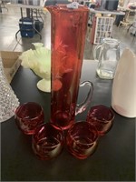CRANBERRY GLASS PITCHER AND 4 GLASSES
