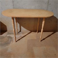 oblong compressed wood table with glass top