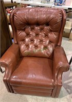 Burgundy brown leather reclining chair with a