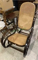 1970s cane seat rocking chair with curved lines.