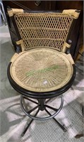 Vintage woven wicker counter stool with a foot